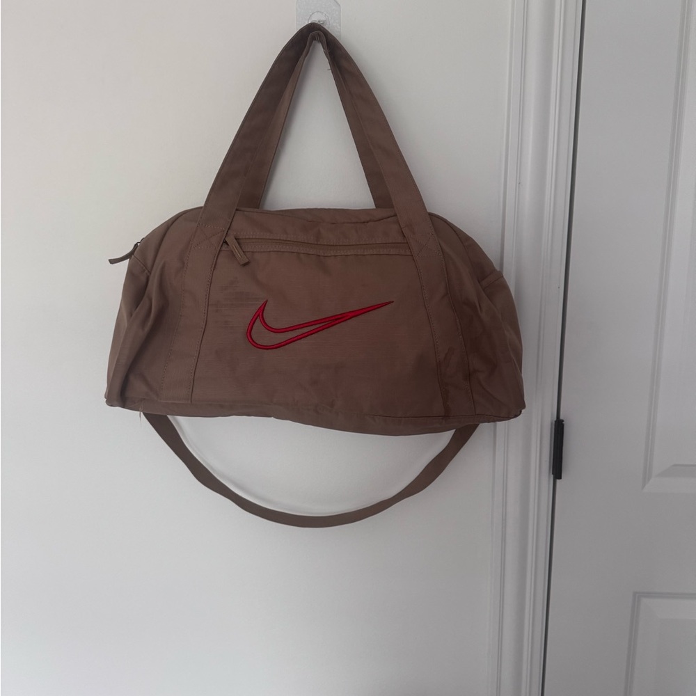 Nike Tan Duffel Bag with Red Swoosh